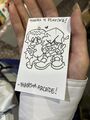 Boyfriend and Girlfriend making V-signs along with a thank-you note from PhantomArcade, drawn for a fan at an Anime Expo.